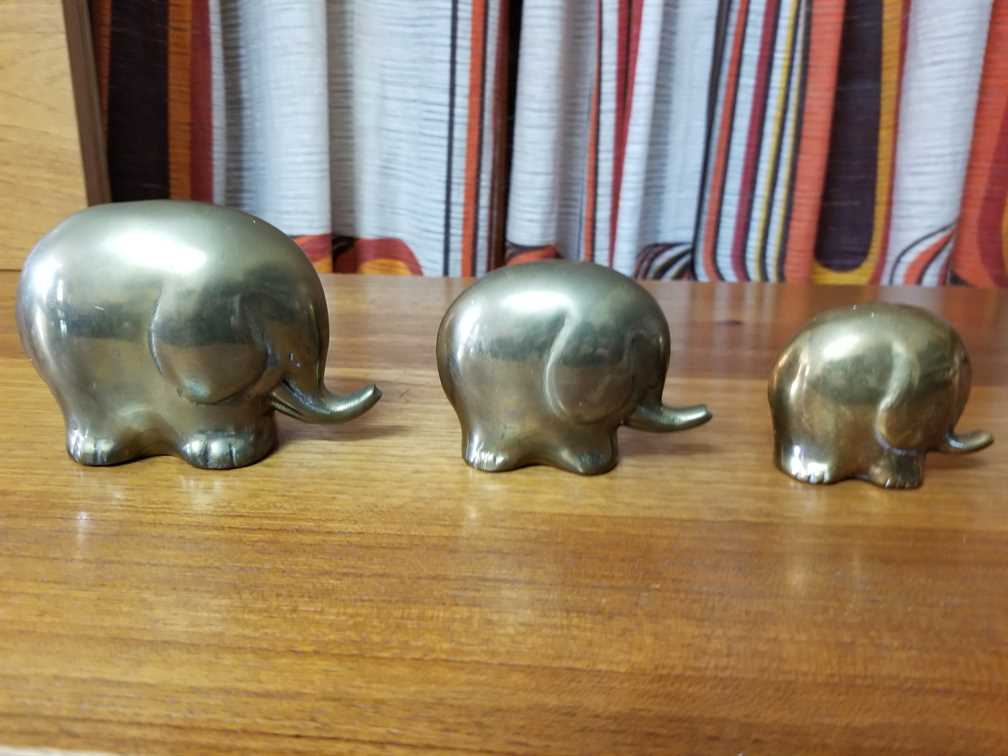 Set of three small brass Elephants