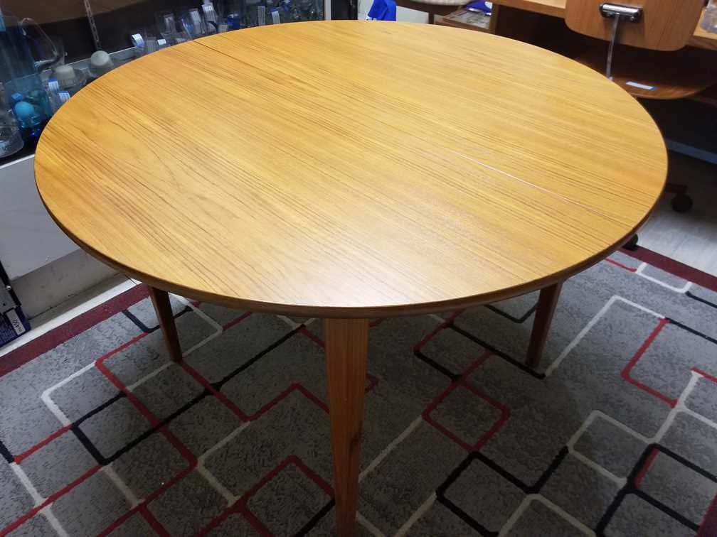 Nordsjo Nordstrom & Sjogren AB, Malmo Sweden Round - Oval Teak Dining Table w/ 1 leaf
