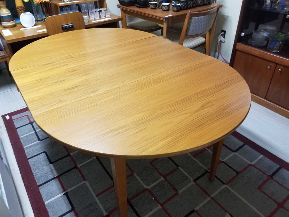 Nordsjo Nordstrom & Sjogren AB, Malmo Sweden Round - Oval Teak Dining Table w/ 1 leaf